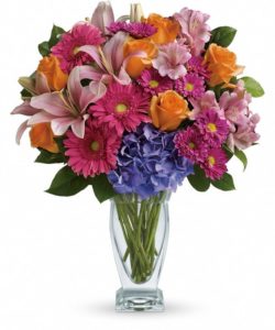 Wonder and admiration. That's what's included in this enchanting bouquet. It's a beautiful mix of luminous blossoms in a glass vase. (Vases may vary)
