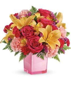 Make any day exceptional with a surprise delivery of jubilant blooms in a stylish cube vase. This bouquet of pink roses and opulent peach lilies will make their mood soar!