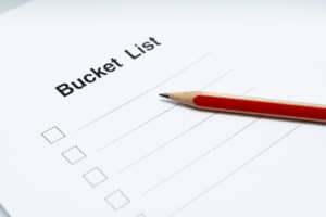 Bucket list red pencil and paper